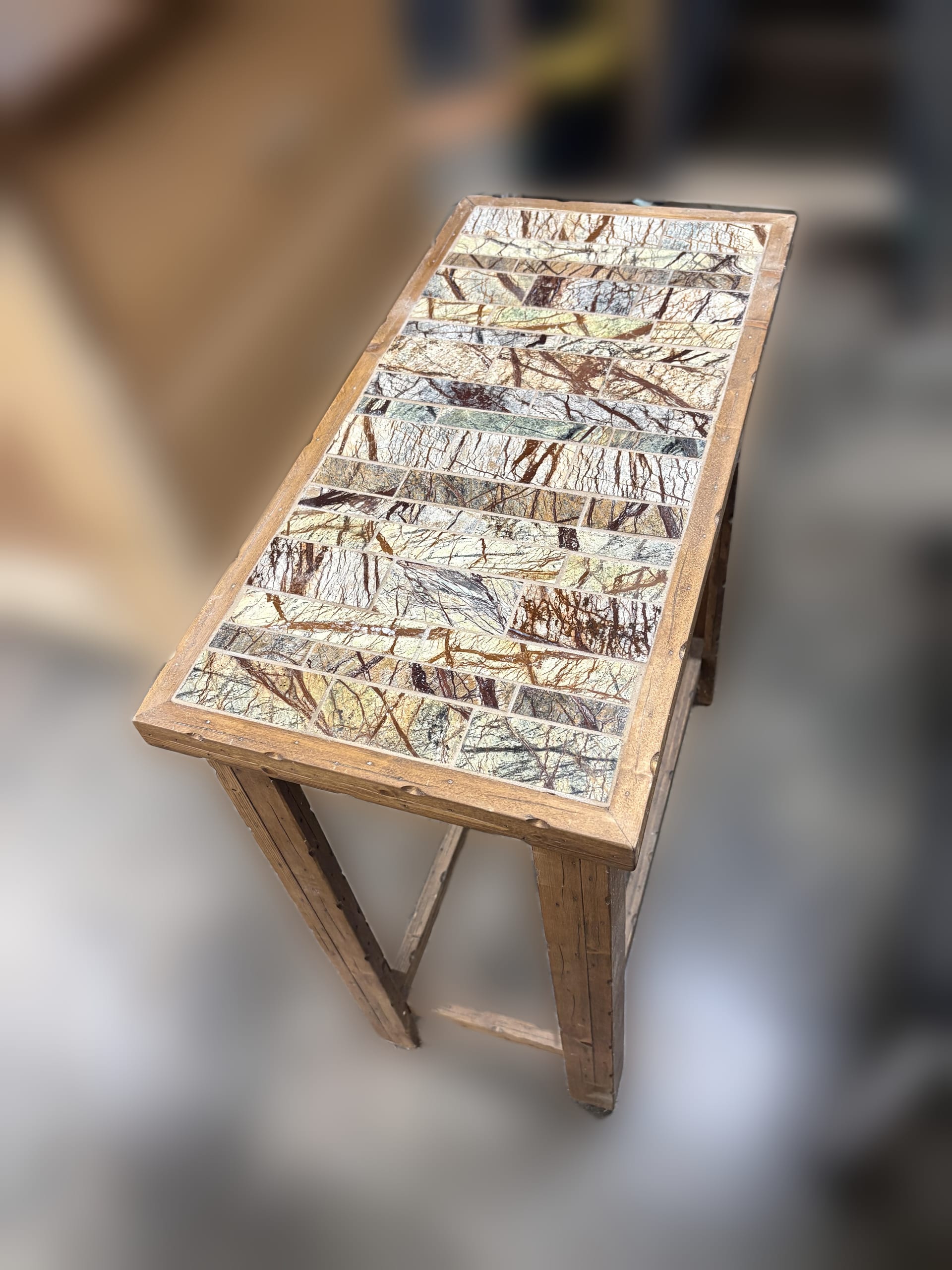 Handcrafted table with green marble mosaic top
